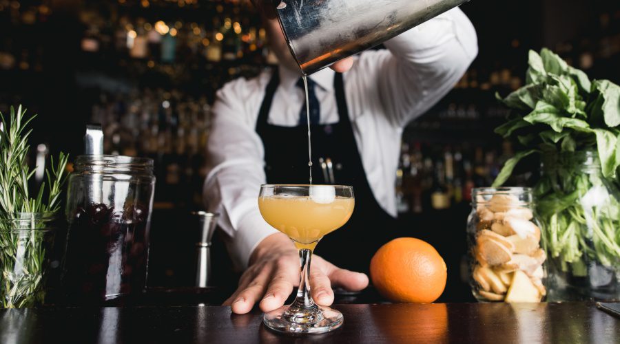 Bartender pouring cocktail